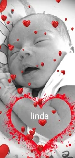 Adorable newborn with heart accents wallpaper.