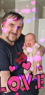 Man holding baby with pink hearts and 'LOVE' text overlay.