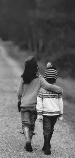 Two kids walking arm in arm on a serene path in black and white.