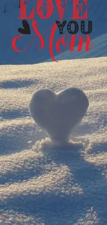 Heart-shaped snow with 'Love You Mom' text in winter landscape.