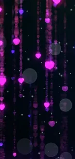 Glowing pink hearts on dark background wallpaper.