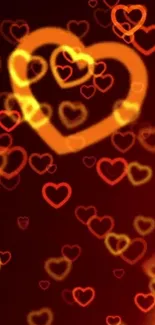 Mobile wallpaper with glowing golden hearts on a dark red background.