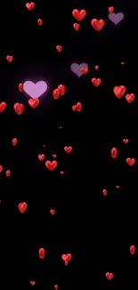 Romantic wallpaper with red hearts on a black background for mobile.