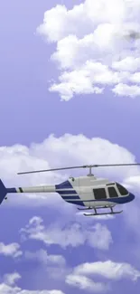 Helicopter flying through a blue sky with clouds.