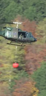 A helicopter flying above a lush green forest landscape.