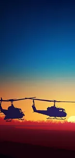 Silhouette of helicopters against sunset sky.