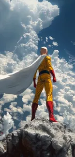 Hero in a yellow suit stands on a rock against a cloudy sky.