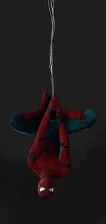 Superhero upside down on dark background wallpaper.