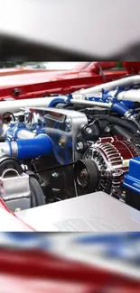 Detailed view of a high-performance car engine with red and blue highlights.