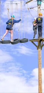 Two people enjoy a high ropes course under a clear blue sky.