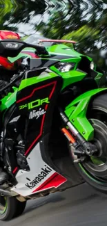 Green Kawasaki Ninja motorcycle in motion wallpaper.