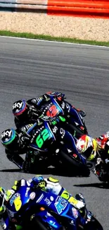 Motorcycle racers banking in a fast curve.