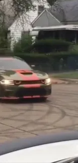 Olive green muscle car drifting on a residential street with tire marks.