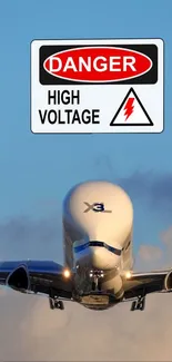 Airplane in sky with high voltage warning sign.