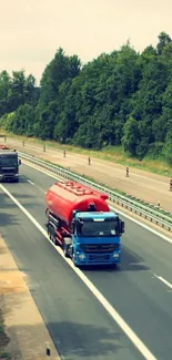 Trucks driving on a lush green highway background.