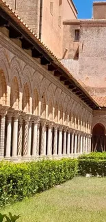 Historic courtyard with brick arches and greenery.