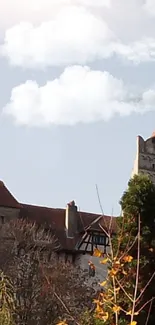 Majestic castle with a tower under a clear blue sky.