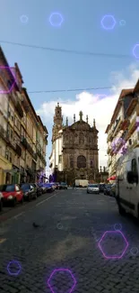 Charming historic city street with cobblestones and classic buildings under a blue sky.