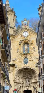 Historic European church amidst colorful street buildings.