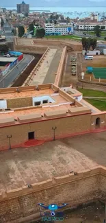 Aerial view of a historic fort in a cityscape setting.