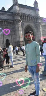 Visitor in front of historic monument with vibrant crowd.