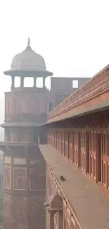 Historic Mughal architecture with intricate details on a red sandstone building.