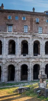 Historic Roman architecture with stone arches under a clear sky.