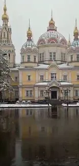 Historic cathedral reflecting in a snowy pond.