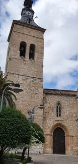 Historic stone church under a vibrant sky.