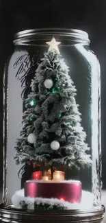 Christmas tree inside glass jar with festive lights.