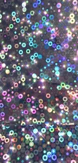 Vibrant holographic glitter sequin wallpaper with colorful sparkles and light effects.