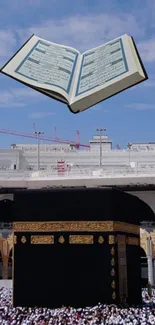 Mobile wallpaper of the Kaaba and an open Quran with a blue sky backdrop.