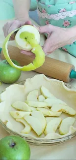 Hands peeling green apples for baking pie.