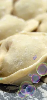 Close-up of homemade dumplings with flour dusting.