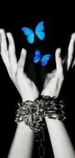 Chained hands release vibrant blue butterflies.