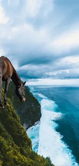 Majestic horse on cliff by ocean under dramatic blue sky.