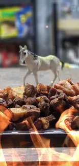 Horse figurine with roasted meat and fire background.