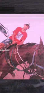 Rider in red on a brown horse with pink tones.