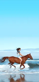 Woman riding a horse along the beach with a bright blue sky.