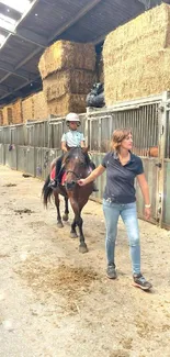 Child learning horse riding in a rustic stable.