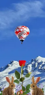 Hot air balloon over snowy mountains with rabbits.