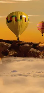 Hot air balloons float above a sunset-lit landscape and clouds.