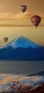 Hot air balloons float above snow-capped mountains at sunset.