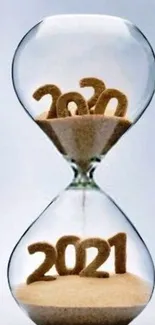 Hourglass transitioning from 2020 to 2021 made of sand.