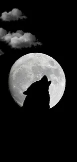 Silhouette of a wolf howling at the full moon in a dark sky.