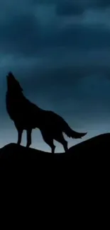 Wolf silhouette against a dark, cloudy blue night sky wallpaper.