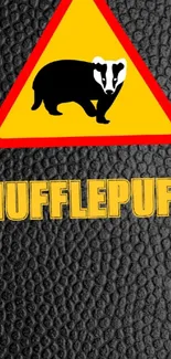 Hufflepuff phone wallpaper with badger logo on yellow background.