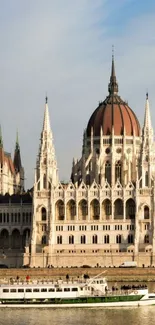 Mobile wallpaper featuring the Hungarian Parliament Building against a blue sky.