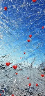 Red hearts over icy blue wallpaper background.