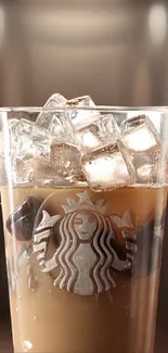 Iced coffee with ice cubes in a branded glass.